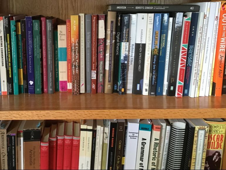 Collin Bjork's rhetoric books on oak bookcase